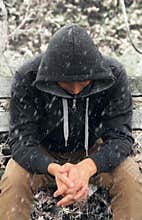 Sad man sitting on bench