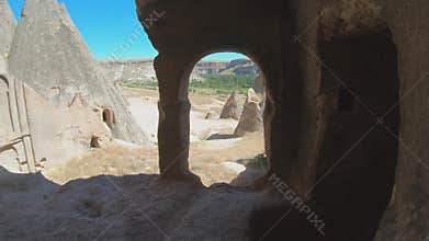 Cappadocia fairy chimneys and cave houses reveal passages inside carved volcanic rock, goreme, turkiye, ancient site