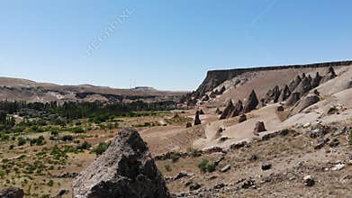 Aerial drone view of Cappadocia fairy chimneys and sculpted volcanic valleys in Turkiye, rock formations, badlands, volcanic tuff