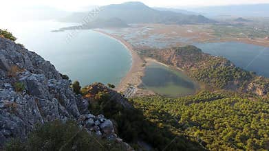 Panoramic drone view of Dalyan lagoon lake forest and mountains above reed filled wetlands, reeds, delta, mugla, turkiye
