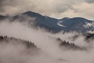 Global warming. mountain landscape. Clouds and fog
