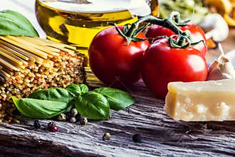 Italian and Mediterranean food ingredients on old wooden background.