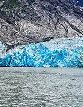 Endicott Arm, Alaska Fjord water icebergs and black sun glowing  mountains at the Fjord of Endicott Arm