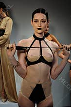 NEW YORK, NY - OCTOBER 25: Model poses during Love Cage Spring 2015 lingerie presentation