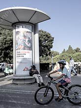 People going about their daily lives in the streets of the city of Valencia