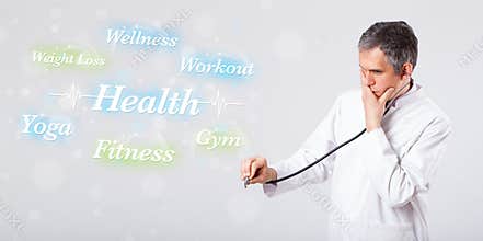 Clinical doctor pointing to health and fitness collection of words
