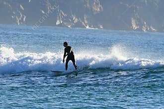 Surfer surfing in the Atlantic waves , ocean, sea sports and adventure , near Ferrol, Galicia, Spain