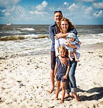 A Family Embracing at the Beach