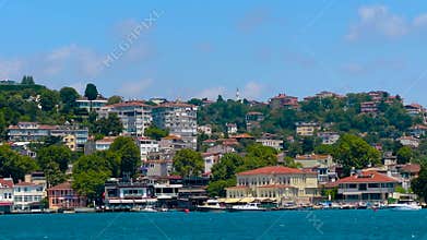 Seagull flying over Bosphorus with Istanbul shoreline - view from ferry