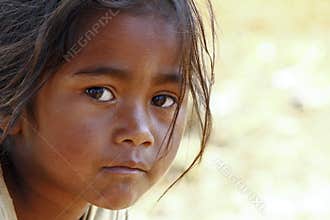 Poverty, portrait of a poor little African girl