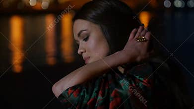 The girl on the background of the city lights