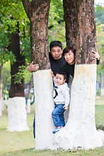 Families look out curiously between the trees
