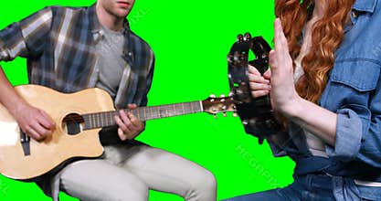 Musicians playing guitar and tambourine