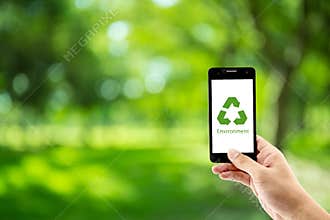 mobile phone holding hand with recycle symbol eco environment