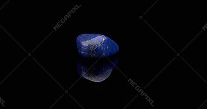 Lapis Lazuli gemstone rotating black surface