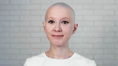 Portrait of a happy cancer survivor woman smiling and looking into the camera