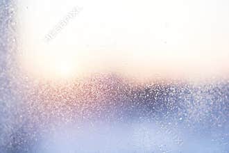 Raindrops on a window glass for rain, sunset.