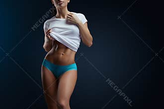 Muscular woman standing