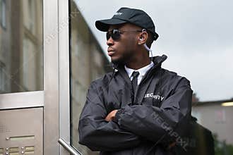 Security Guard Standing Arms Crossed