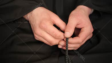 Man Praying With Rosary