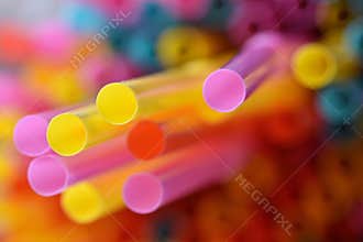 Drinking straws. Macro abstract image with beautiful multi-colored background.