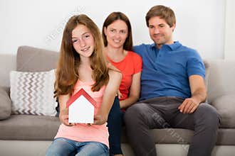 Girl Holding Small House Model