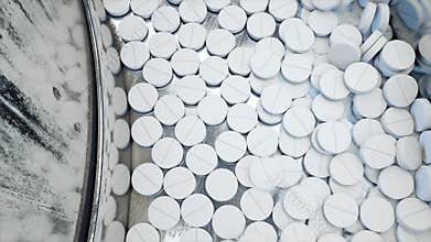 Process of production of pills, tablets. Industrial pharmaceutical concept. Factory equipment and machine. Steel