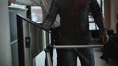 Entrance Gate Access Touch technology security system Office Building with businessmans going to work