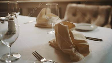 Dolly shot close up beautifully served table in restaurant warm tones