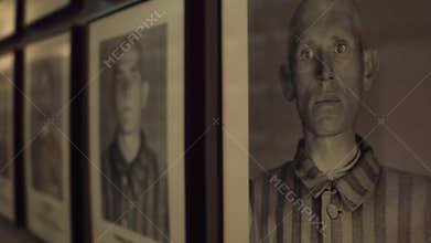 OSWIENCIM, POLAND - JANUARY, 14, 2017 Steadicam shot of portraits of Auschwitz Birkenau male victims. German Nazi