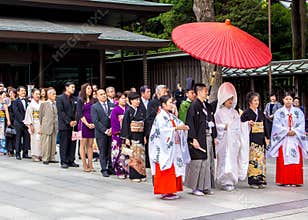 Typical Shinto wedding with a cortege of guests