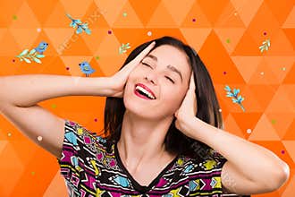 Girl on orange geometric background with birds and colorful spot