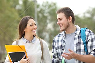 Two students walking and talking
