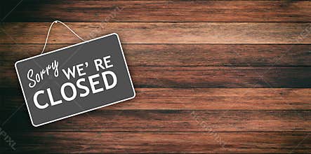 Sorry we are closed sign on wooden background