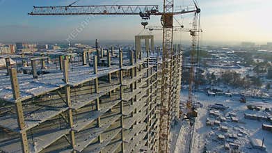 Winter view of a building under construction.