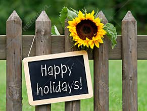 Happy holidays - chalkboard with sunflower