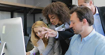 Group of business people analyzing documents point finger on computer motinor, businesspeople team working process in
