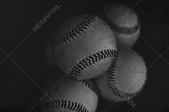 Pile of balls used to play with in baseball game, athletic look.