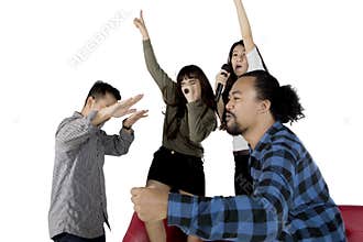 Diverse people singing karaoke