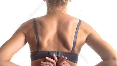 Woman taking off her bra