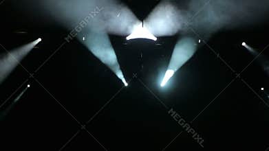 White stage lights in a free concert hall.