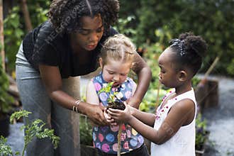 Teacher and kids school learning ecology gardening