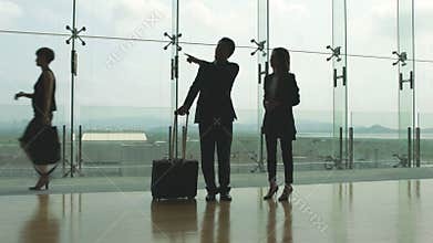 Business people talking in airport terminal