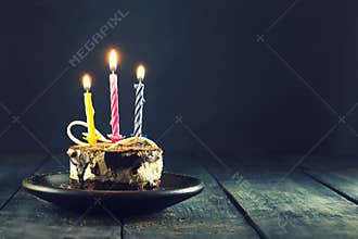 Chocolate cake with a candle and gifts.Happy Birthday, card. Holidays greeting card.