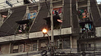 BANGKOK, THAILAND - CIRCA March 2017: Asian poor houses and high powered electric cables