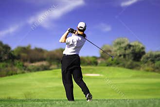 Golfer teeing off c