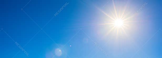 Bright sun on blue sky