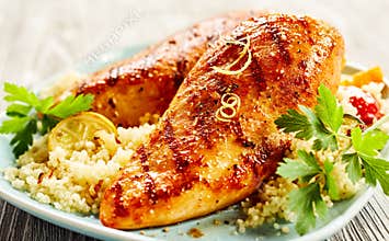 Poultry with couscous served on plate