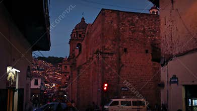 Pan From Balcony To Busy Street At Dusk In South American Town