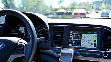 Motion of driver with GPS navigation on dashboard